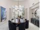 Dining room showcases a decorative chandelier, large wood table, and natural light through a large window at 8815 N 65Th St, Paradise Valley, AZ 85253