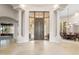 Spacious foyer featuring columns, a large front door, and views into the dining area at 8815 N 65Th St, Paradise Valley, AZ 85253