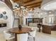 Spacious great room with high ceilings, wooden beams, dining area, living room, and staircase at 8815 N 65Th St, Paradise Valley, AZ 85253