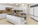 Bright kitchen features granite countertops, a large island with bar seating and stainless steel appliances at 8815 N 65Th St, Paradise Valley, AZ 85253