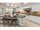 Bright kitchen features granite countertops, a large island with bar seating and stainless steel appliances at 8815 N 65Th St, Paradise Valley, AZ 85253