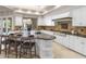 Bright kitchen features granite countertops, a large island with bar seating and stainless steel appliances at 8815 N 65Th St, Paradise Valley, AZ 85253