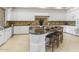 Bright kitchen features granite countertops, a large island with bar seating and stainless steel appliances at 8815 N 65Th St, Paradise Valley, AZ 85253