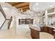 Open floor plan with a wood ceiling, staircase, fireplace, and wet bar at 8815 N 65Th St, Paradise Valley, AZ 85253