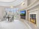 Beautiful living room with fireplace, television and large windows offering bright natural light at 8815 N 65Th St, Paradise Valley, AZ 85253