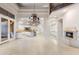 Open floor plan with a kitchen, dining area, fireplace, and large tile floors at 8815 N 65Th St, Paradise Valley, AZ 85253