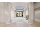 Bright, spacious living room featuring a fireplace, marble floors, and large windows with beautiful views at 8815 N 65Th St, Paradise Valley, AZ 85253