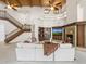 Spacious living room featuring a fireplace, staircase, and vaulted wood beam ceilings at 8815 N 65Th St, Paradise Valley, AZ 85253