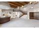 Spacious open floor plan with wood ceilings, staircase, fireplace, wet bar, and access to the kitchen at 8815 N 65Th St, Paradise Valley, AZ 85253