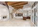 Open floor plan with a staircase, fireplace, wet bar, and wood ceiling at 8815 N 65Th St, Paradise Valley, AZ 85253