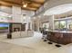 Open floor plan with living room featuring a fireplace and bar with outdoor views at 8815 N 65Th St, Paradise Valley, AZ 85253