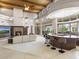 Open-concept living room and bar area with a fireplace and expansive backyard views at 8815 N 65Th St, Paradise Valley, AZ 85253