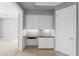 Built-in home office featuring cabinets, a desk area, and gold hardware at 8815 N 65Th St, Paradise Valley, AZ 85253