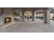 Stunning outdoor living space with fireplace and stone patio overlooking the pool at 8815 N 65Th St, Paradise Valley, AZ 85253