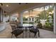 Covered patio with outdoor seating and a view of the landscaped backyard with pool and gazebo at 8815 N 65Th St, Paradise Valley, AZ 85253
