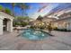 Swimming pool with patio and desert landscaping in a luxury backyard at 8815 N 65Th St, Paradise Valley, AZ 85253