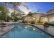 In-ground pool with a hot tub, stone pavers, and lush landscaping at 8815 N 65Th St, Paradise Valley, AZ 85253