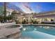 The pool and hot tub are surrounded by stone pavers and manicured landscaping at 8815 N 65Th St, Paradise Valley, AZ 85253