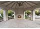 Charming pool pavilion featuring a cozy fireplace and ample space for outdoor gatherings at 8815 N 65Th St, Paradise Valley, AZ 85253