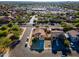 A view of a two-story house in a well-planned community with sidewalks, desert landscaping, and paved roads at 894 S Buena Vista Dr, Apache Junction, AZ 85120