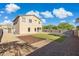 Spacious backyard featuring a patio, artificial turf and desert landscaping at 894 S Buena Vista Dr, Apache Junction, AZ 85120