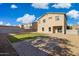 Spacious backyard featuring a patio, artificial turf and desert landscaping at 894 S Buena Vista Dr, Apache Junction, AZ 85120