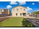 Spacious backyard featuring a patio, artificial turf and desert landscaping at 894 S Buena Vista Dr, Apache Junction, AZ 85120
