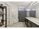 Spacious bathroom featuring double sinks, ample counter space, tub/shower, and a convenient hanging bathrobe at 894 S Buena Vista Dr, Apache Junction, AZ 85120