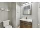 Powder room with updated vanity, fixtures, and a framed mirror, providing a functional space for guests at 894 S Buena Vista Dr, Apache Junction, AZ 85120