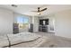 This bedroom has a TV, ceiling fan, natural light from the window, and complementing gray dressers and bedside tables at 894 S Buena Vista Dr, Apache Junction, AZ 85120