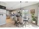 Stylish dining area adjacent to the kitchen features modern lighting and neutral decor at 894 S Buena Vista Dr, Apache Junction, AZ 85120