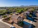 Beautiful two-story home featuring a tile roof with mountain views and desert landscaping in a quiet neighborhood at 894 S Buena Vista Dr, Apache Junction, AZ 85120