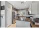 Bright kitchen features stainless steel appliances, granite countertops, and ample storage space at 894 S Buena Vista Dr, Apache Junction, AZ 85120