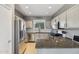 Bright kitchen with stainless steel appliances, granite countertops, and ample storage space at 894 S Buena Vista Dr, Apache Junction, AZ 85120