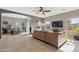Open-concept living room with tile floors and ample natural light, perfect for entertaining at 894 S Buena Vista Dr, Apache Junction, AZ 85120
