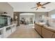 Inviting living room with tile flooring, neutral tones, and open access to the dining and kitchen areas at 894 S Buena Vista Dr, Apache Junction, AZ 85120