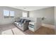 Comfortable loft area features a gray sofa, side table, and natural light from the window, ideal for relaxation at 894 S Buena Vista Dr, Apache Junction, AZ 85120