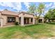 Well-manicured backyard featuring a covered patio area with seating at 9120 W Wescott Dr, Peoria, AZ 85382