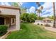 Well-maintained backyard with lush grass and a view of the community pool at 9120 W Wescott Dr, Peoria, AZ 85382