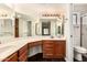 Bathroom with dual sinks, a vanity, and a glass shower at 9120 W Wescott Dr, Peoria, AZ 85382