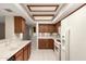 View of the kitchen, showing a double sink and white appliances at 9120 W Wescott Dr, Peoria, AZ 85382