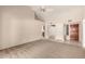 Spacious living room with neutral carpet and ample space at 9120 W Wescott Dr, Peoria, AZ 85382