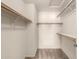 Walk-in closet with shelving and carpet at 9120 W Wescott Dr, Peoria, AZ 85382