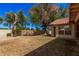 View of the private backyard with mature trees at 9414 S La Rosa Dr, Tempe, AZ 85284
