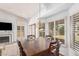 Dining room features a dark wooden table and white walls, with great light at 9414 S La Rosa Dr, Tempe, AZ 85284