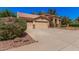 Well-maintained home featuring a spacious three-car garage and desert landscaping at 9414 S La Rosa Dr, Tempe, AZ 85284