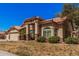 Attractive home featuring well-maintained landscaping and a spacious three-car garage at 9414 S La Rosa Dr, Tempe, AZ 85284