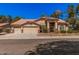 Charming single-story home showcasing a tile roof and a spacious three-car garage at 9414 S La Rosa Dr, Tempe, AZ 85284