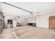 Spacious garage with ample storage space and lighting, suitable for parking and projects at 9414 S La Rosa Dr, Tempe, AZ 85284