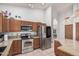 The kitchen includes stainless steel appliances, granite countertops, and beautiful lighting at 9414 S La Rosa Dr, Tempe, AZ 85284